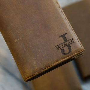 Close-up light brown full grain leather long wallet with personalized monogram