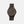 A brown wooden watch with a blue second hand and a black matching adjustable wood band