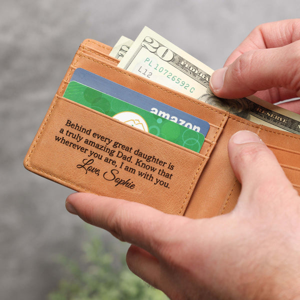 Personalized fathers day engraving on the inside left pocket of a light brown full grain leather bifold for men